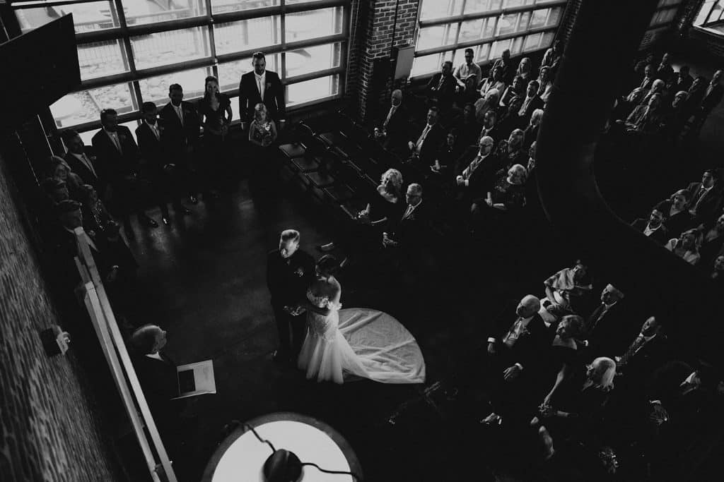 Looking down on ceremony at MHS black and white B K mile high station denver colorado wedding portrait photographer 308 websize 1024x683