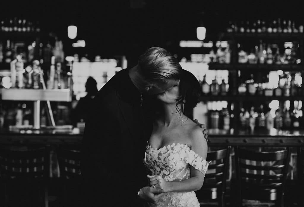 MHS first look kiss at bar B K mile high station denver colorado wedding portrait photographer 145 websize 1024x698